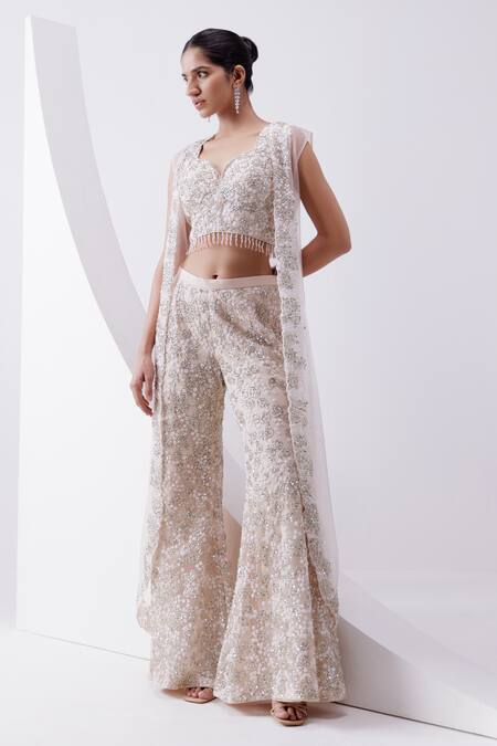 Shop_Istya_Peach Net Sequins, Beads, Embroidery Sweetheart Neck, Rose Sharara And Jacket Set _at_Aza_Fashions