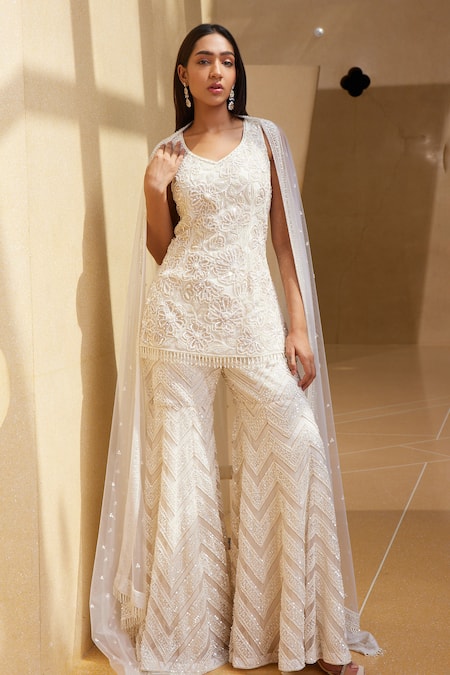 Shop_Istya_Ivory Net Beads, Sequins, Tassels Boat Neck Floral Embroidered Kurta Sharara Set _at_Aza_Fashions