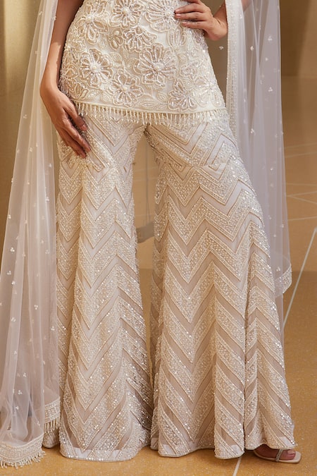 Istya_Ivory Net Beads, Sequins, Tassels Boat Neck Floral Embroidered Kurta Sharara Set _Online_at_Aza_Fashions