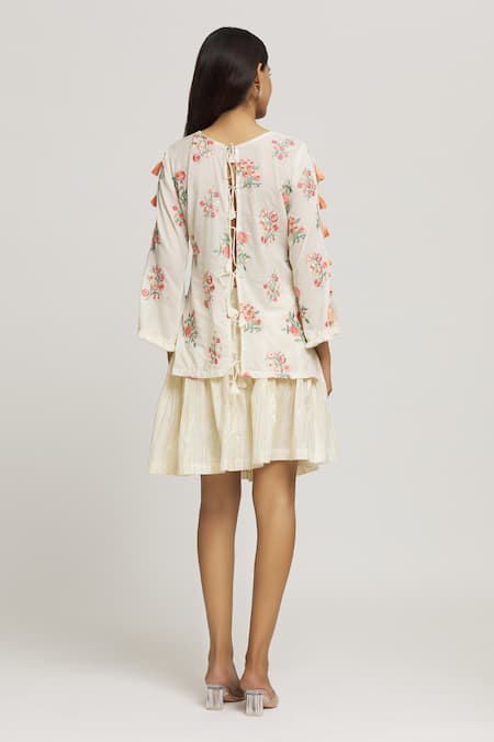 Shop Kunwarani Ritu Cream Cotton Tassels, Embroidery Round Neck Floral Top With Skirt at Aza Fashions Shop_Kunwarani Ritu_Cream Cotton Tassels, Embroidery Round Neck Floral Top With Skirt _at_Aza_Fashions