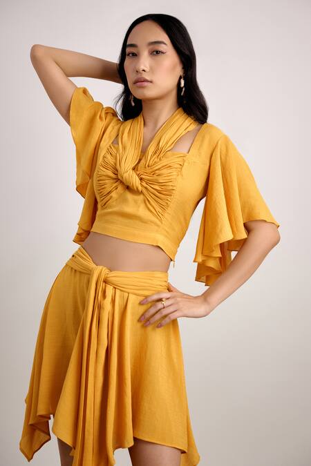 Echostudio Yellow Linen, Crepe Halter Neck Knotted Draped Crop Top And Skirt Set Online at Aza Fashions Echostudio_Yellow Linen, Crepe Halter Neck Knotted Draped Crop Top And Skirt Set _Online_at_Aza_Fashions