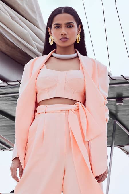 Nirmooha Peach Microfiber Solid Shawl Lapel Collar Blazer With Belt Online at Aza Fashions Nirmooha_Peach Microfiber Solid Shawl Lapel Collar Blazer With Belt _Online_at_Aza_Fashions
