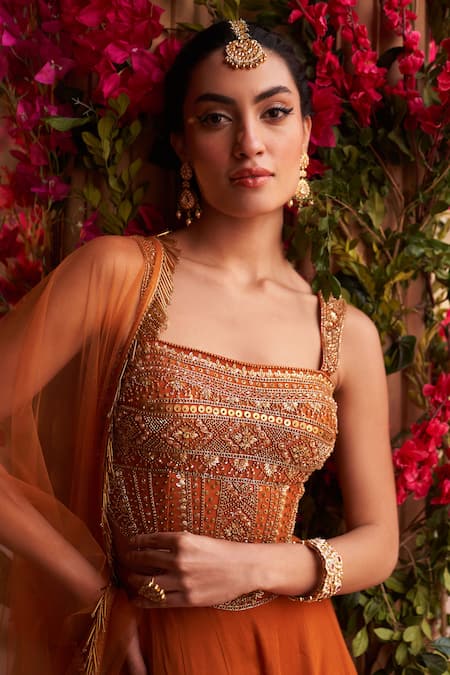 Reeti Arneja_Orange Net, Georgette Sequins, Beads, Embroidery Floral Corset Sharara Set _at_Aza_Fashions