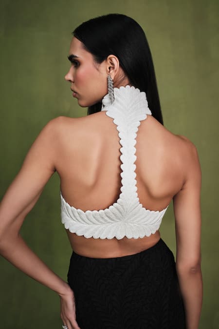 Shop Pankaj & Nidhi Ivory Satin, Suede Pearls, Pearlesque Encrusted Harness Top With Engraved Skirt at Aza Fashions Shop_Pankaj & Nidhi_Ivory Satin, Suede Pearls, Pearlesque Encrusted Harness Top With Engraved Skirt _at_Aza_Fashions