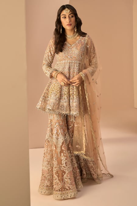 LASHKARAA Peach Net Embroidery Thread V Neck Zari Peplum Kurta Gharara Set 