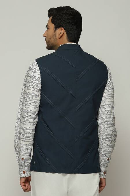 Shop Abraham And Thakore Blue Poplin Sleeveless Diagonal Pleats Bundi at Aza Fashions Shop_Abraham And Thakore_Blue Poplin Sleeveless Diagonal Pleats Bundi_at_Aza_Fashions