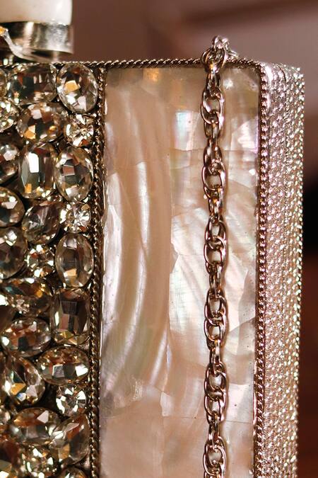 The Tan Clan Silver Mother Of Pearls Liyana Embellished Clutch at Aza Fashions The Tan Clan_Silver Mother Of Pearls Liyana Embellished Clutch _at_Aza_Fashions