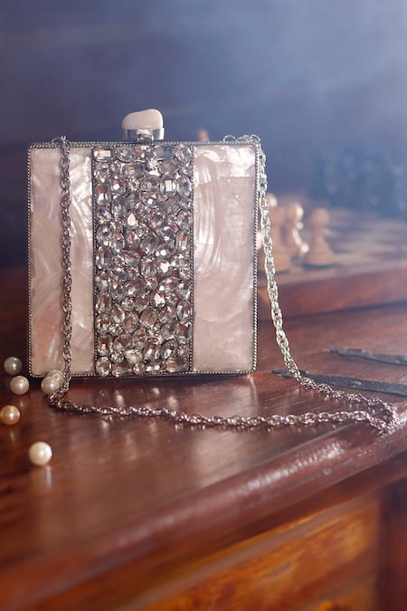 Shop The Tan Clan Silver Mother Of Pearls Liyana Embellished Clutch at Aza Fashions Shop_The Tan Clan_Silver Mother Of Pearls Liyana Embellished Clutch _at_Aza_Fashions