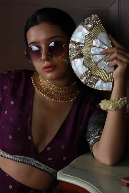 The Tan Clan_Gold Crystals, Stones, Pearls Pankh Mother Of Embellished Clutch _at_Aza_Fashions