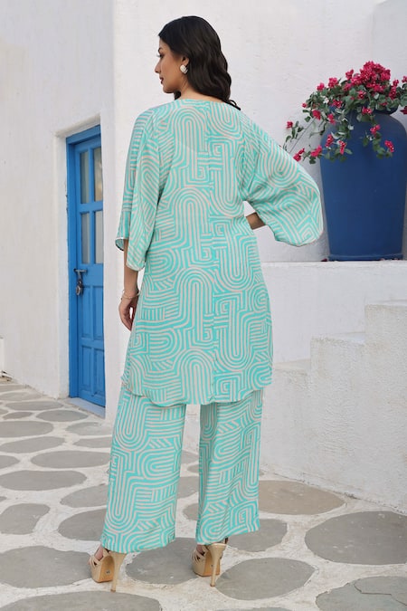 Shop Seams Pret And Couture Blue Crepe, Cotton Sequins V-neck Vania Geometric Print Long Top With Pant at Aza Fashions Shop_Seams Pret And Couture_Blue Crepe, Cotton Sequins V-neck Vania Geometric Print Long Top With Pant _at_Aza_Fashions