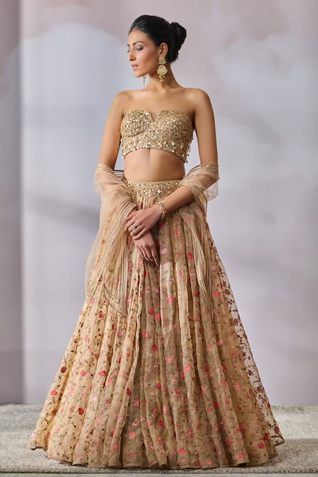 PASTEL PEACH BUTI WORK BOX PLEATED LEHENGA WITH A HAND EMBROIDERED BLOUSE  PAIRED WITH A MATCHING SCALLOPED DUPATTA AND SILVER DETAILS. - Seasons India