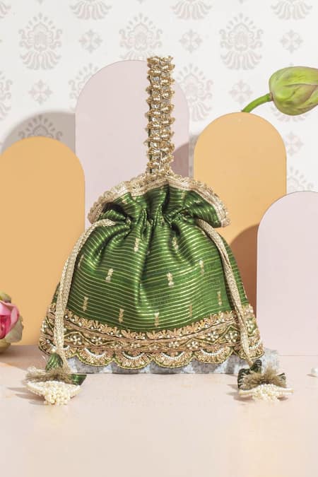 Buy Turquoise woven embroidered potli bag by Amyra at Aashni and Co