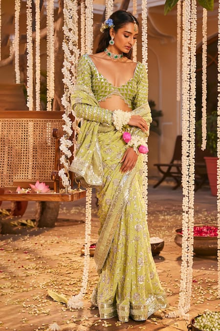 Shop The Royaleum Green Crepe, Silk Crystals, Sequins Plunge Neck Embroidered Saree Set at Aza Fashions Shop_The Royaleum_Green Crepe, Silk Crystals, Sequins Plunge Neck Embroidered Saree Set _at_Aza_Fashions
