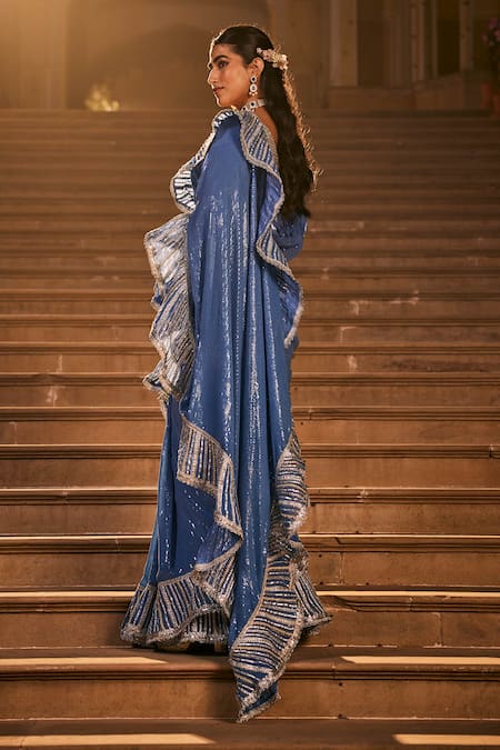 Shop The Royaleum Blue Silk Sequins, Gota Patti V-neck Embroidered Frilled Border Saree Set at Aza Fashions Shop_The Royaleum_Blue Silk Sequins, Gota Patti V-neck Embroidered Frilled Border Saree Set _at_Aza_Fashions