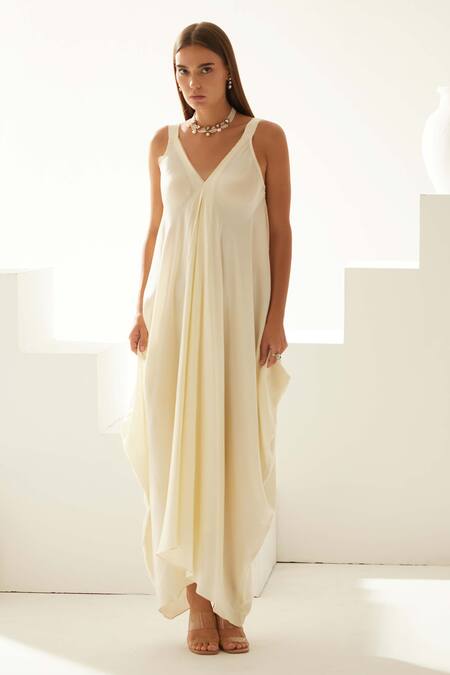 Wear Jaja Cream Modal V-neck Solid V Asymmetrical Maxi Dress Online at Aza Fashions Wear Jaja_Cream Modal V-neck Solid V Asymmetrical Maxi Dress_Online_at_Aza_Fashions