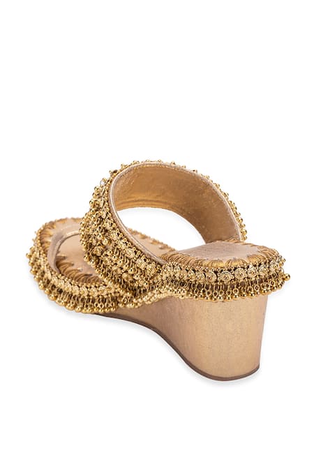 Shop 5elements Gold Gota Patti Asteria Ghungroo Embellished Kolhapuri Wedges Online at Aza Fashions Shop_5elements_Gold Gota Patti Asteria Ghungroo Embellished Kolhapuri Wedges _Online_at_Aza_Fashions