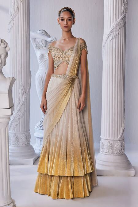Buy_Mandira Wirk - Indian_Cream Net, Lycra Beads, Sequins, Cut Work Embroidered Corset Layered Lehenga Set _Online_at_Aza_Fashions