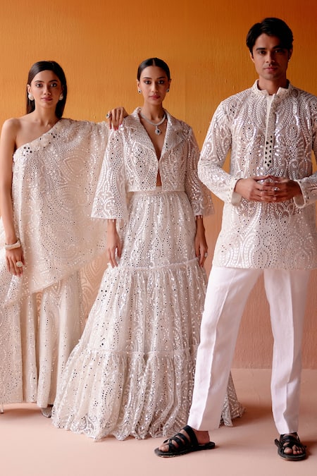 Twenty Nine White Net Mirrors V-neck Three Tiered Embellished Lehenga And Jacket Set Online at Aza Fashions Twenty Nine_White Net Mirrors V-neck Three Tiered Embellished Lehenga And Jacket Set _Online_at_Aza_Fashions