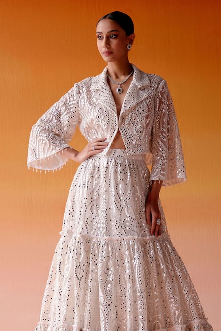 Shop Twenty Nine White Net Mirrors V-neck Three Tiered Embellished Lehenga And Jacket Set Online at Aza Fashions Shop_Twenty Nine_White Net Mirrors V-neck Three Tiered Embellished Lehenga And Jacket Set _Online_at_Aza_Fashions
