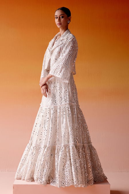 Twenty Nine White Net Mirrors V-neck Three Tiered Embellished Lehenga And Jacket Set at Aza Fashions Twenty Nine_White Net Mirrors V-neck Three Tiered Embellished Lehenga And Jacket Set _at_Aza_Fashions