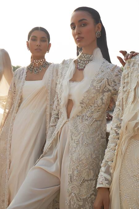 Ridhima Bhasin_Ivory Crepe, Organza Pearls Square Neck, Zenaia Work Ruffle Jacket Pant Set _at_Aza_Fashions