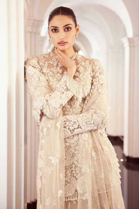 Seema Gujral Beige Net Embroidered Floral Round Sheer Kurta Sharara Set Online at Aza Fashions Seema Gujral_Beige Net Embroidered Floral Round Sheer Kurta Sharara Set _Online_at_Aza_Fashions