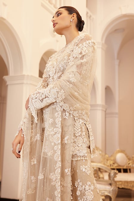 Shop Seema Gujral Beige Net Embroidered Floral Round Sheer Kurta Sharara Set Online at Aza Fashions Shop_Seema Gujral_Beige Net Embroidered Floral Round Sheer Kurta Sharara Set _Online_at_Aza_Fashions