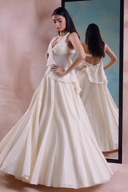 Shop Shwetanga Ivory Cotton Beads, Pearls Halter Neck Beaded Floret Peplum Top With Lehenga Online at Aza Fashions Shop_Shwetanga_Ivory Cotton Beads, Pearls Halter Neck Beaded Floret Peplum Top With Lehenga _Online_at_Aza_Fashions