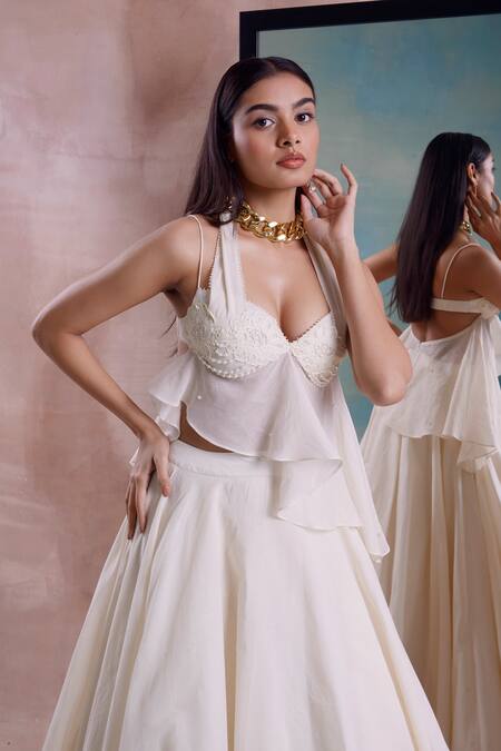 Shwetanga_Ivory Cotton Beads, Pearls Halter Neck Beaded Floret Peplum Top With Lehenga _at_Aza_Fashions