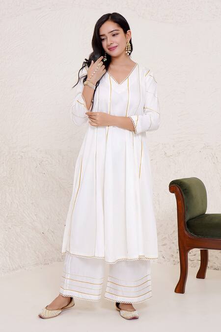 Buy Nero India Ivory Cotton Satin, Chanderi Gota Patti Work Panelled Anarkali And Pant Set Online at Aza Fashions Buy_Nero India_Ivory Cotton Satin, Chanderi Gota Patti Work Panelled Anarkali And Pant Set _Online_at_Aza_Fashions