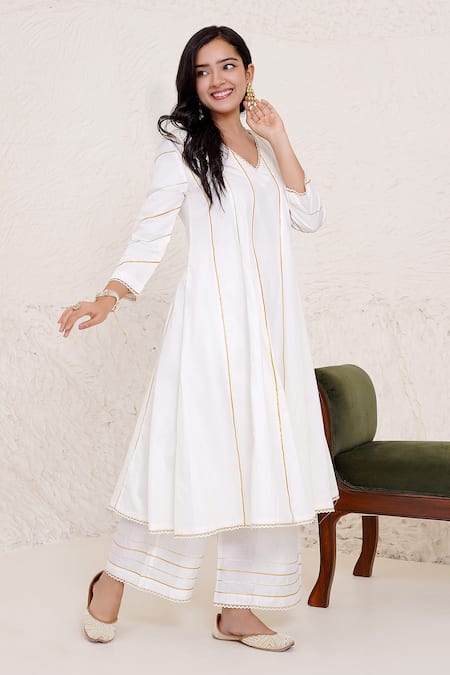 Shop Nero India Ivory Cotton Satin, Chanderi Gota Patti Work Panelled Anarkali And Pant Set Online at Aza Fashions Shop_Nero India_Ivory Cotton Satin, Chanderi Gota Patti Work Panelled Anarkali And Pant Set _Online_at_Aza_Fashions