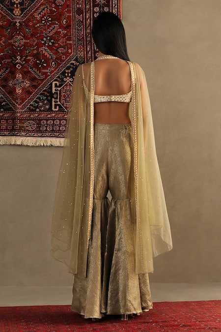 Shop RI.Ritu Kumar Gold Blouse Shell 100% Silk Embroidery Sequin Cape Darpan Work Gharara Set at Aza Fashions Shop_RI.Ritu Kumar_Gold Blouse Shell 100% Silk Embroidery Sequin Cape Darpan Work Gharara Set _at_Aza_Fashions