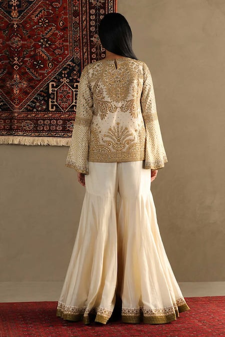 Shop RI.Ritu Kumar White Top- 100% Silk Embroidered Round Darpan And Sharara Set at Aza Fashions Shop_RI.Ritu Kumar_White Top- 100% Silk Embroidered Round Darpan And Sharara Set_at_Aza_Fashions