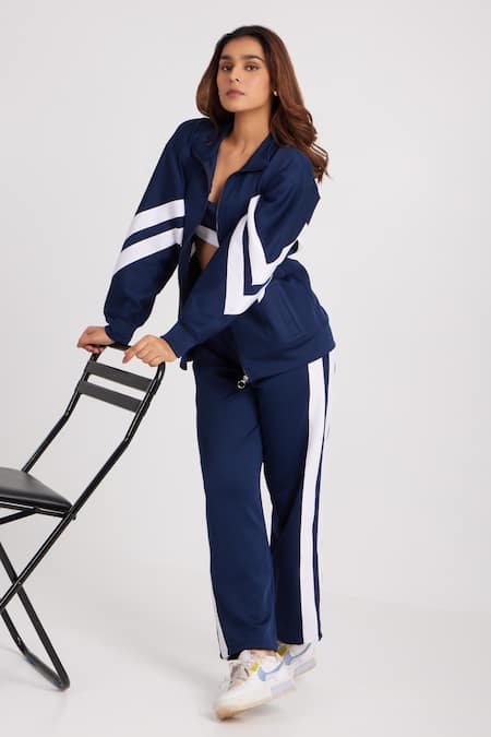 Shop Dawn And Dusk Blue Polyester High Neck Sky Striker Colour Block Tracksuit Set at Aza Fashions Shop_Dawn And Dusk_Blue Polyester High Neck Sky Striker Colour Block Tracksuit Set_at_Aza_Fashions
