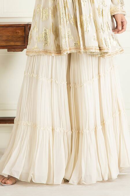 Priyanka Jain Ivory Lurex, Georgette, Cotton Sequins, Embroidered Peplum Kurta Sharara Set at Aza Fashions Priyanka Jain_Ivory Lurex, Georgette, Cotton Sequins, Embroidered Peplum Kurta Sharara Set_at_Aza_Fashions