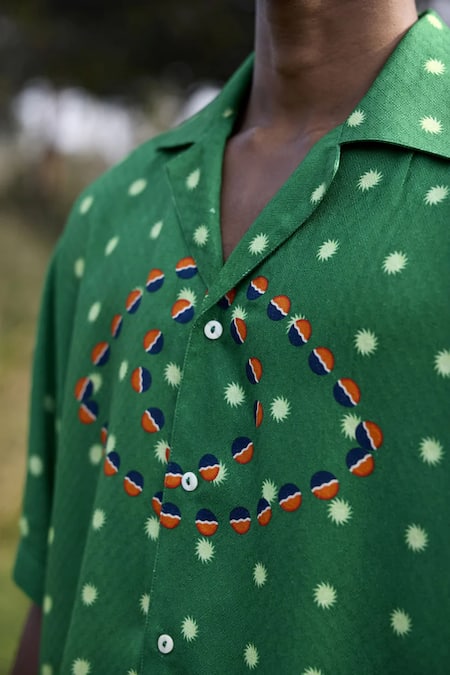 Triune Green Rayon Club Bali And Sun Print Lapel Collar Shirt Online at Aza Fashions Triune_Green Rayon Club Bali And Sun Print Lapel Collar Shirt_Online_at_Aza_Fashions