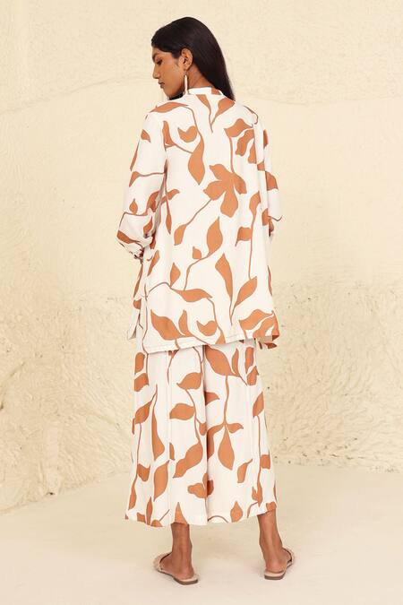 Shop Kanelle White Cotton Mandarin Collar Selena Leaf Print Tunic And Trouser Set at Aza Fashions Shop_Kanelle_White Cotton Mandarin Collar Selena Leaf Print Tunic And Trouser Set_at_Aza_Fashions