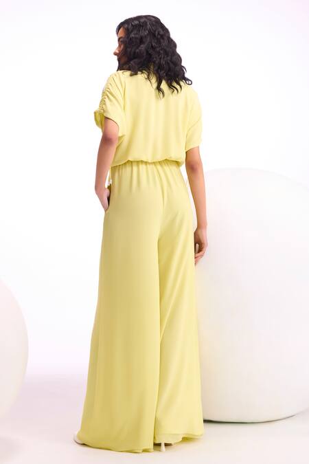 Shop Namrata Joshipura Yellow Textured Crepe Embellished Bead Collar Opal Jumpsuit at Aza Fashions Shop_Namrata Joshipura_Yellow Textured Crepe Embellished Bead Collar Opal Jumpsuit_at_Aza_Fashions