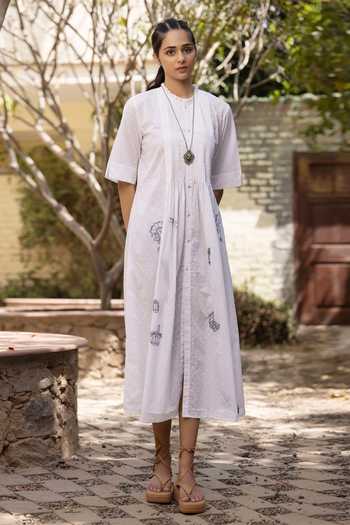 Shop Kahani Lush White Cotton Embroidery Round Neck Multi Motif Shirt Dress at Aza Fashions Shop_Kahani Lush_White Cotton Embroidery Round Neck Multi Motif Shirt Dress _at_Aza_Fashions