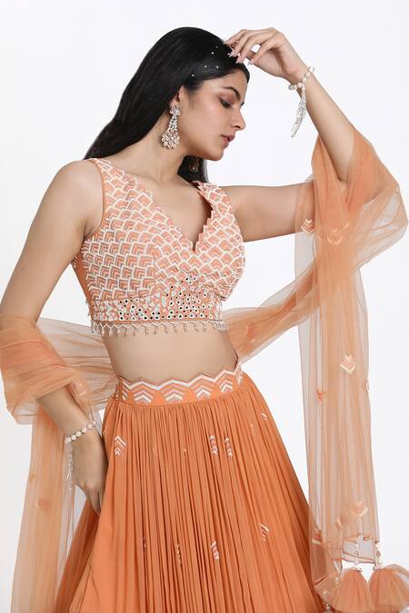 Shop_Nitisha Kashyap Official_Peach Silk, Net, Georgette Cut Work, Beads, Hand Embroidered Blouse Lehenga Set _Online_at_Aza_Fashions