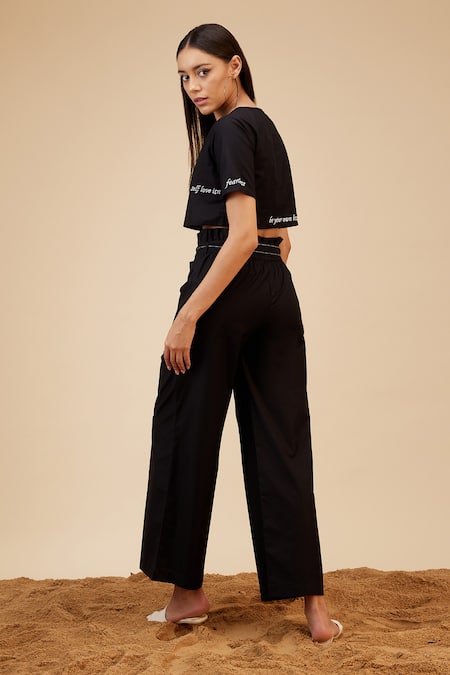 Shop Bohobi Black Linen Embroidery Round Neck Slogan Crop Top With Wide Leg Pant at Aza Fashions Shop_Bohobi_Black Linen Embroidery Round Neck Slogan Crop Top With Wide Leg Pant _at_Aza_Fashions