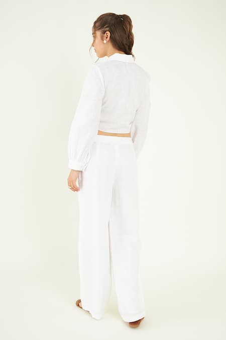 Shop Bohobi White Linen Embroidery Collared, V-neck Knotted Crop Shirt With Flared Pant at Aza Fashions Shop_Bohobi_White Linen Embroidery Collared, V-neck Knotted Crop Shirt With Flared Pant _at_Aza_Fashions