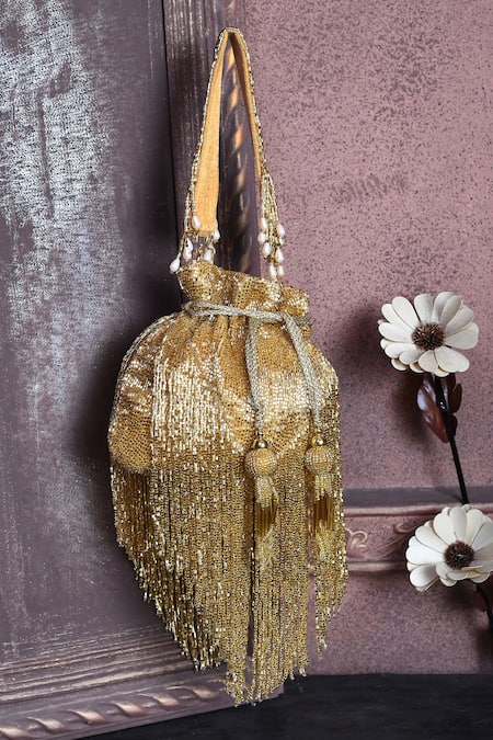 Shop_House Of Webhin_Gold Cut Work, Tassels Embellished Potli _at_Aza_Fashions