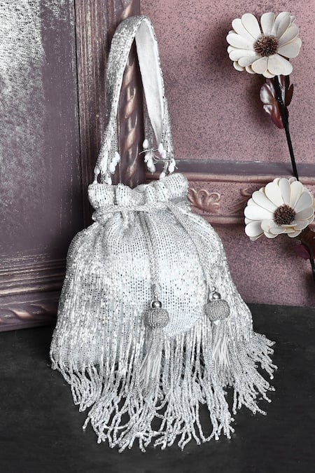 Shop_House Of Webhin_White Cut Work, Tassels Embellished Potli Bag With Handle _at_Aza_Fashions