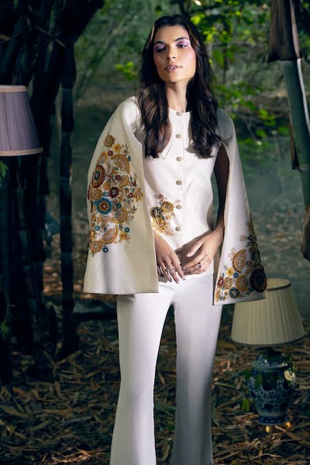 Shop Shreeka Ivory Lycra Embroidery 3d Flower Cape Jacket And Pant Set at Aza Fashions Shop_Shreeka_Ivory Lycra Embroidery 3d Flower Cape Jacket And Pant Set _at_Aza_Fashions