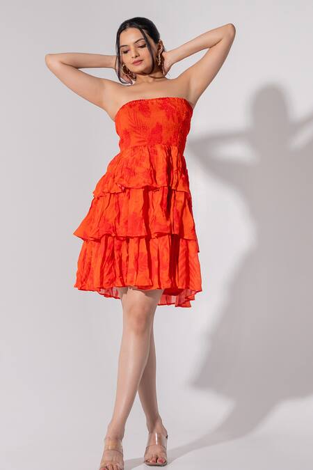 Saangi_Orange Chiffon Off-shoulder Florid Print Frilly Tiered Tube Dress_at_Aza_Fashions