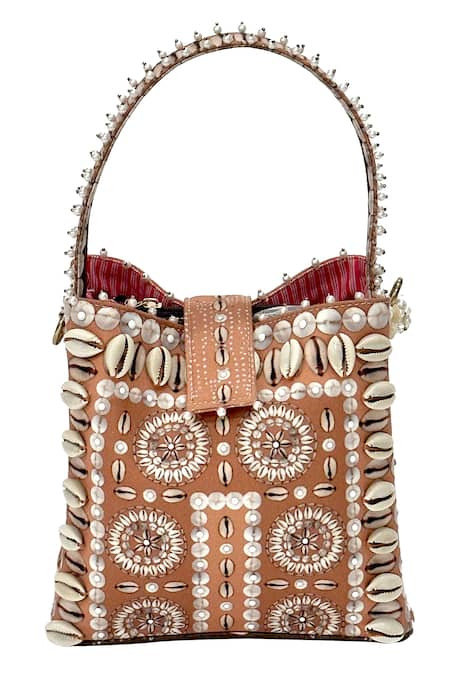 Shop_The Garnish Company_Beige Cowrie Shells Zoya Embellished Bucket Bag _at_Aza_Fashions