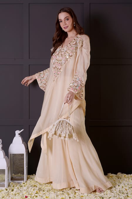 Surabhi Arya_Ivory Crepe, Organza Pearls, Sequins Collared, Hand Embroidered Cape Jacket Set _at_Aza_Fashions