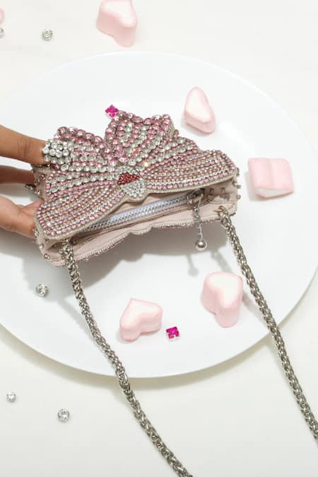 Shop Ozel Pink Rhinestone Bow Arm Candy Embellished Clutch at Aza Fashions Shop_Ozel_Pink Rhinestone Bow Arm Candy Embellished Clutch _at_Aza_Fashions