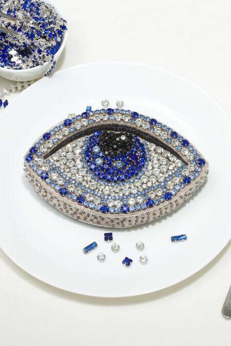 Shop Ozel Blue Rhinestone Evil Eye Arm Candy Embellished Clutch at Aza Fashions Shop_Ozel_Blue Rhinestone Evil Eye Arm Candy Embellished Clutch _at_Aza_Fashions
